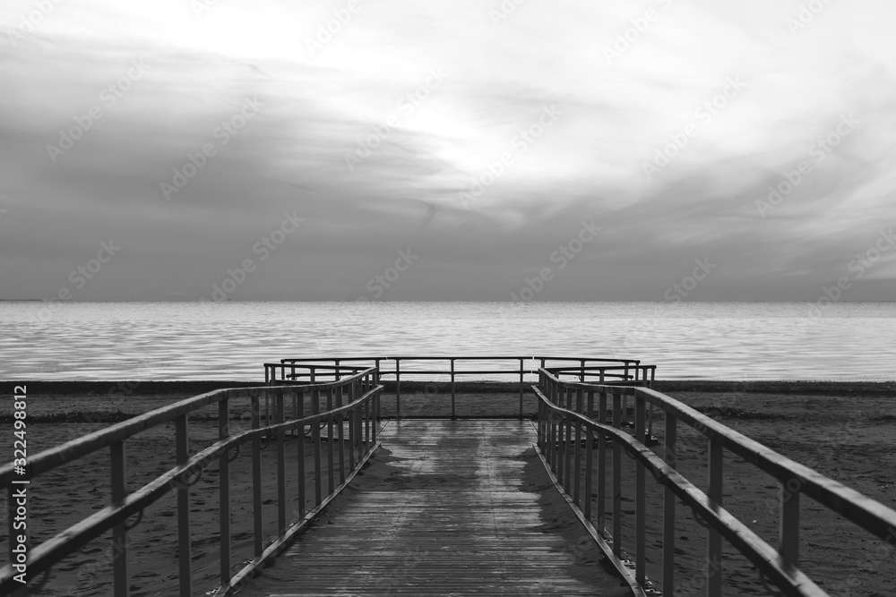 Pier on the bay black and white
