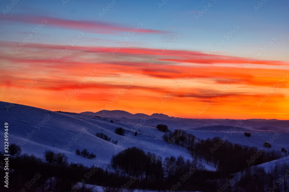 Colorful sunset over the hill