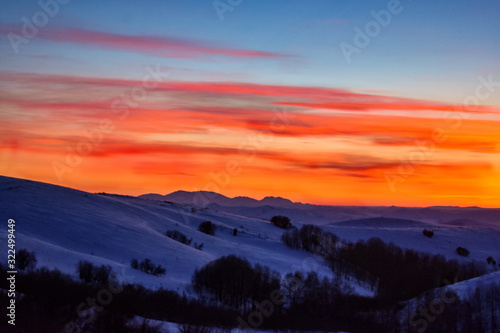 Fototapeta Naklejka Na Ścianę i Meble -  Colorful sunset over the hill