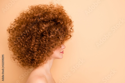 Close up side profile photo beautiful she her wear no clothes nude lady look empty space sincere positive salon stylist curls perms roller curlers tint cool wow result isolated beige pastel background