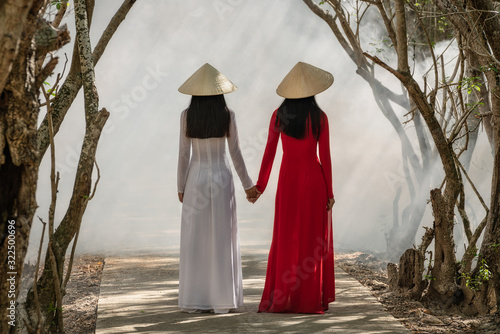 Hue, Vietnam - July 27, 2019 : Friends walking in the forest