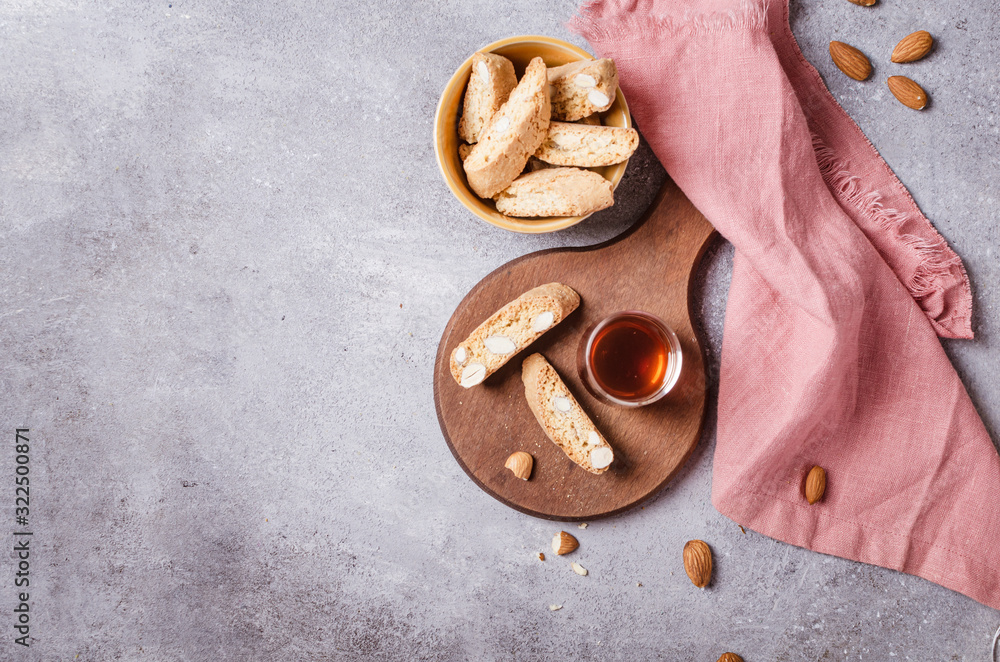 Italian tuscan traditional cookies cantuccini with desert wine in glass.