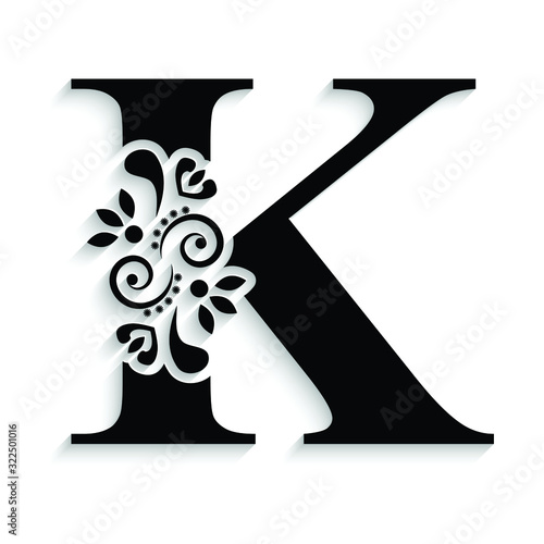 letter K. Black flower alphabet.  Beautiful capital letter with shadow