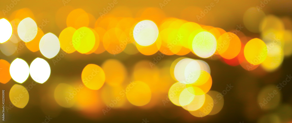 Fototapeta premium Blurred night city lights photo. Abstract pattern background in bokeh effect.