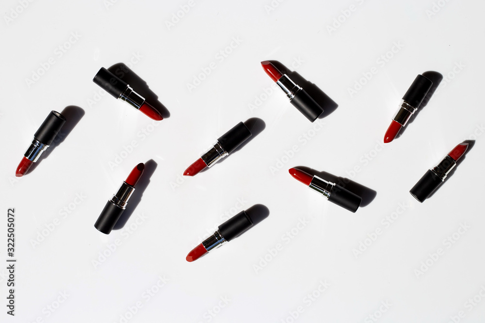 Flat lay composition, Lipsticks on white background with shadow. Beautiful Make-up concept Flat lay composition, Lipsticks on white background with shadow. Beautiful Make-up concept