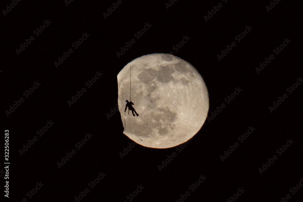 Naklejka premium Climbing on the Moon