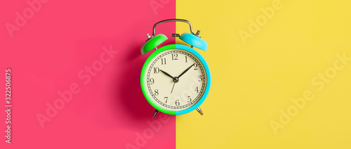 Tableau sur toile Trendy Multicolored alarm clock on bright colorful background