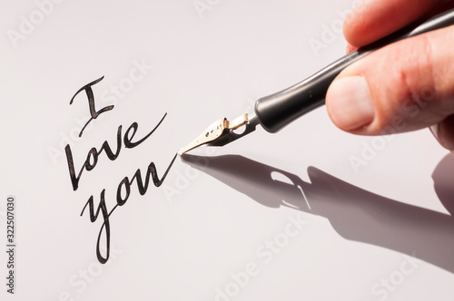 Romantic I Love You message handwritten in black ink with a calligraphy pen