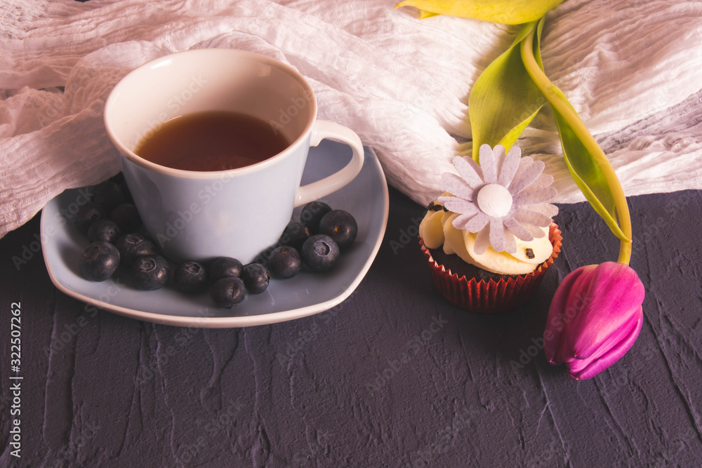 cup of coffee, berries and tulip on the table cup of coffee, berries and tulip on the table