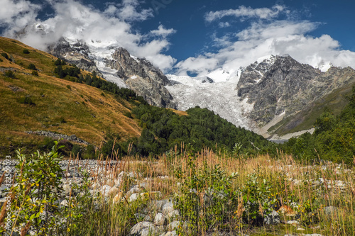 Mountain landscape with Lardaad glacier and footpash full of stones photo