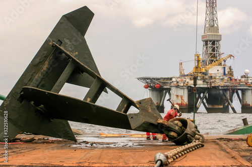 POINTE NOIRE CONGO - 2009 APRIL 10. The semi-submersible drilling rig Global Santafe GSF 135 rig anchor on deck on Bourbon Borgstein.