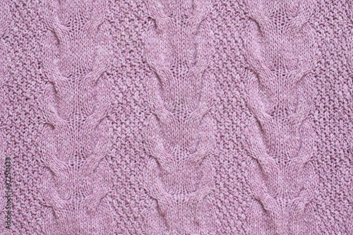 Cabels and purl knit stitches pattern, handmade purple color woolen knitwear cloth, soft knitted fabric wallpaper