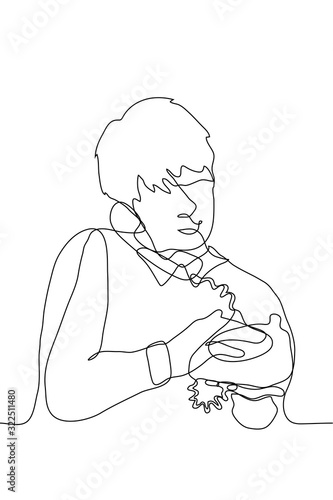 Sketch of a young man with an old-fashioned vintage telephone. A young guy talking on a landline phone. One continuous line drawing of a man holding an outdated phone