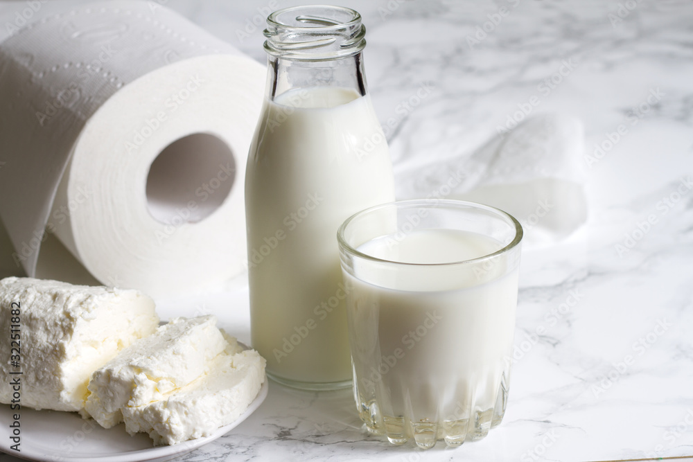 Lactose intolerance and diarrhea concept with diary and toilet paper Lactose intolerance and diarrhea concept with diary and toilet paper