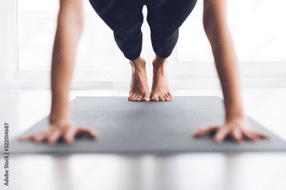 Woman doing plank exercise or push ups at modern studio Woman doing plank exercise or push ups at modern studio
