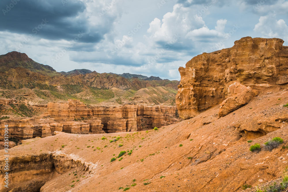 view of the canyon against a cloudy, stormy sky