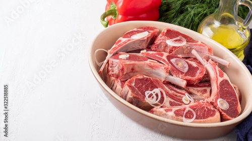 Fresh raw mutton on the bone with ingredients for marinate. Copyspace