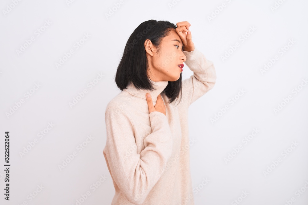 Young chinese woman wearing turtleneck sweater standing over isolated white background Touching forehead for illness and fever, flu and cold, virus sick Young chinese woman wearing turtleneck sweater standing over isolated white background Touching forehead for illness and fever, flu and cold, virus sick