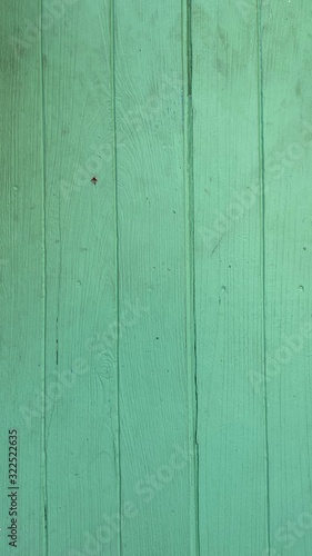 Background, textures, and patterns of wood which is painted in green.