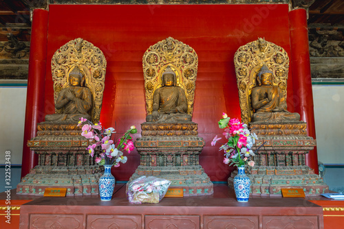 Interior of Buddhist Temple of Wisdom Attained - Zhihua - located in Lumicang hutong in Beijing, capital city of China photo