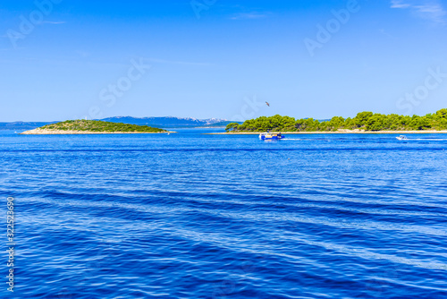 Green islands in the sea. Mediterranean island with rocky coast. Vacation travel destination, Archipelago Kornati, Dalmatia, Croatia, Europe