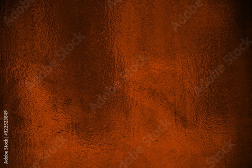 Glänzende Metalloberfläche in rot braun als Hintergrund
