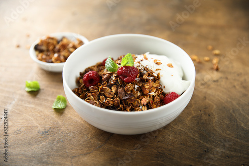 Homemade granola with raspberry and yogurt