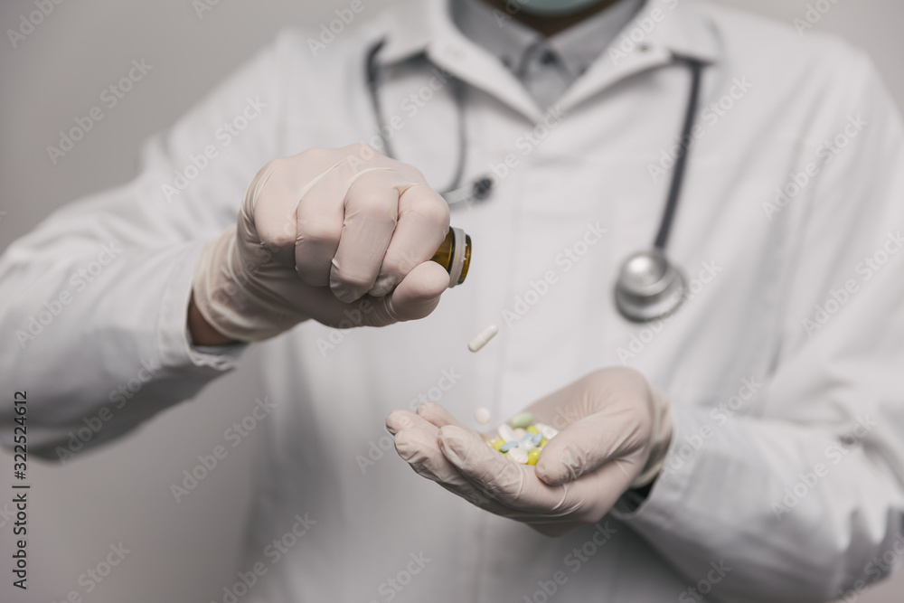 Close-up of male doctor giving too much pills. Overdose concept. Close-up of male doctor giving too much pills. Overdose concept.