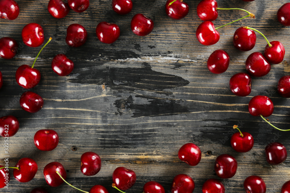 Bunch of fresh organic sweet cherries on textured background. Clean eating concept. Healthy nutritious vegan snack, raw diet. Close up, copy space, top view, flat lay. Bunch of fresh organic sweet cherries on textured background. Clean eating concept. Healthy nutritious vegan snack, raw diet. Close up, copy space, top view, flat lay.
