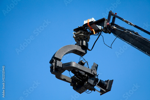 Foto Image of a jib camera or camera crane with sky background