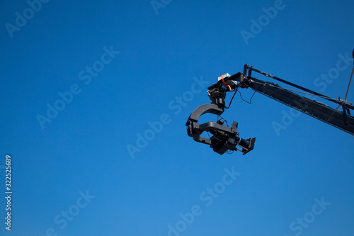 Image of a jib camera or camera crane with sky background 