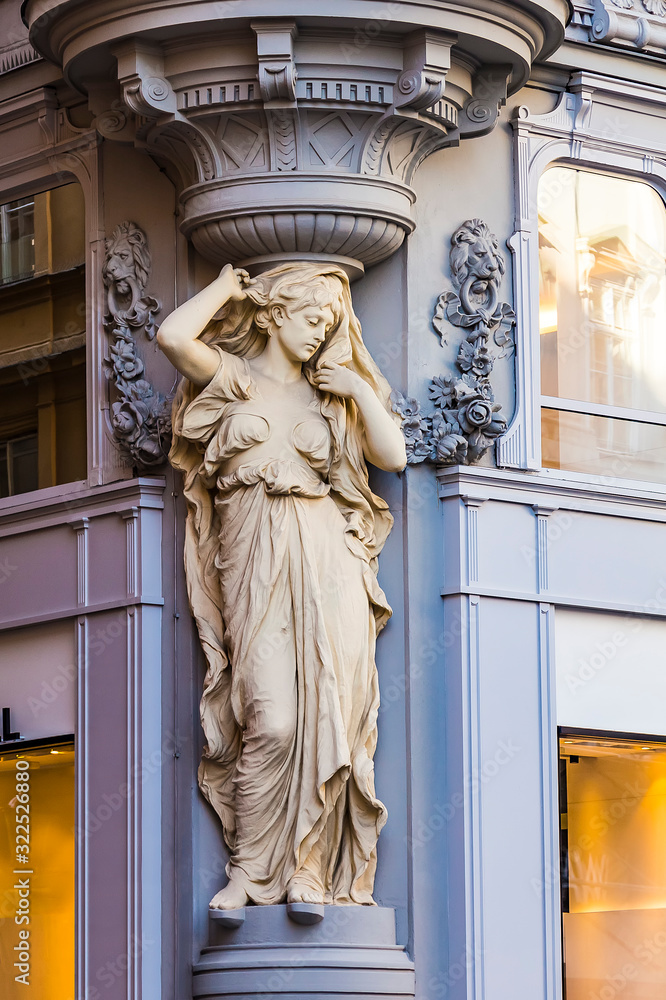 Caryatid statue on the facade of a building in Tuchlauben street, Vienna, Austria 