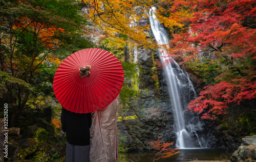 Photography Pre wedding photo for Japanese couple and red umbrella on the red bridge in mino