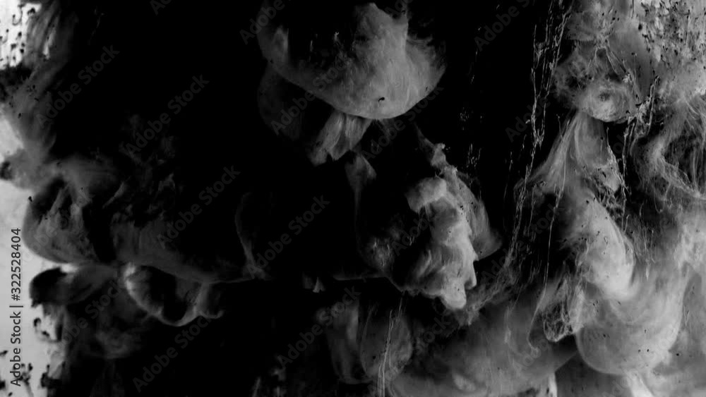 Explosion and spread of black combustible mixture on a white background ...