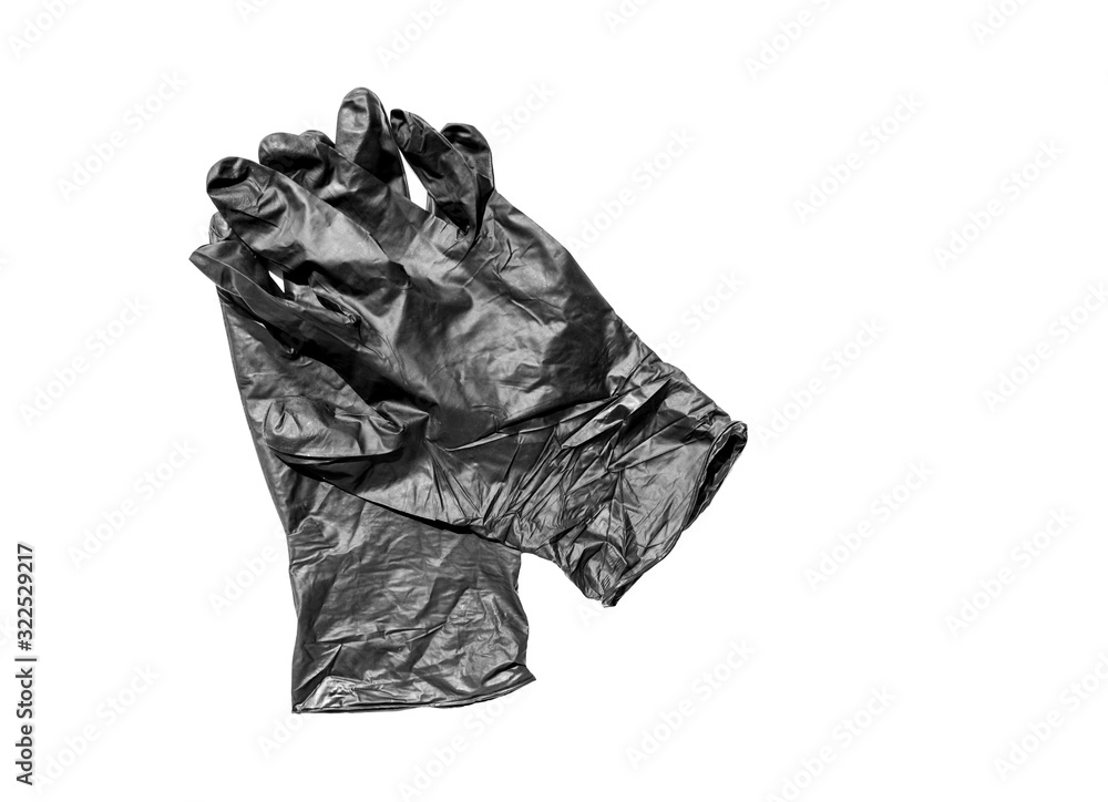 pair of rubber protective black gloves one on another isolated on white background. New disposable rubber gloves