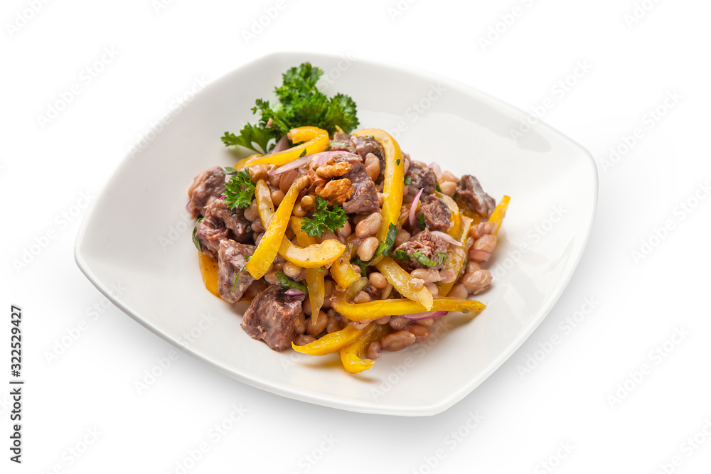 stew of white beans and bell yellow pepper with beef meat closeup with ingredients. On a white plate, isolated. stew of white beans and bell yellow pepper with beef meat closeup with ingredients. On a white plate, isolated.