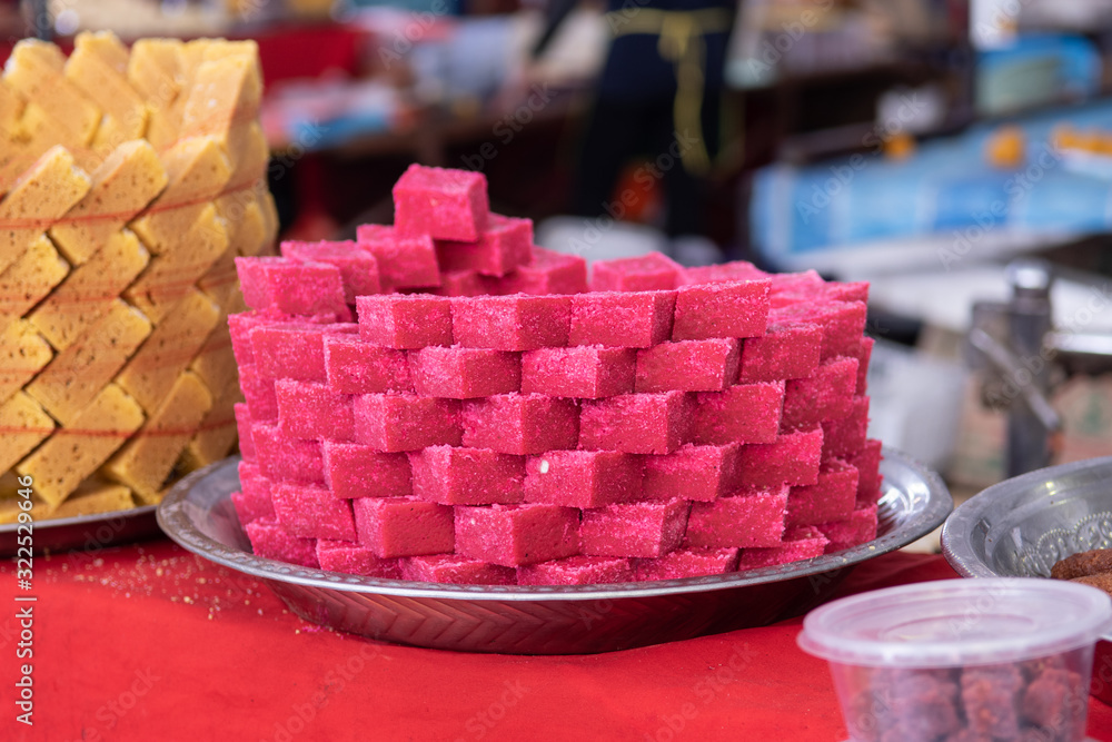 Pink Indian sweet desert cakes for sale at Thaipusam festival at market