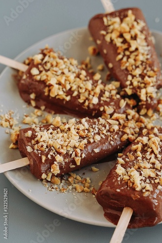 Chocolate ice cream with nuts. Raw desserts