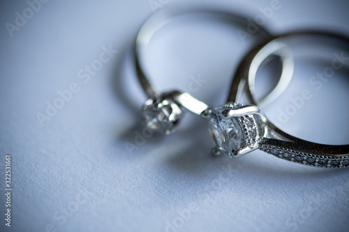Close up of two diamond silver rings