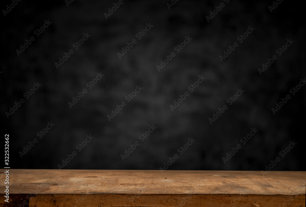 Wood table and black concrete wall background. can be used to install the product. Wood table and black concrete wall background. can be used to install the product.