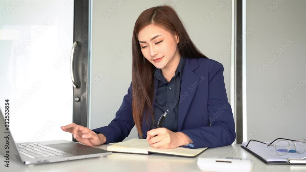 4k video of Concentrated young beautiful young asian woman using laptop while sitting at her desk working in the office work station 4k video of Concentrated young beautiful young asian woman using laptop while sitting at her desk working in the office work station