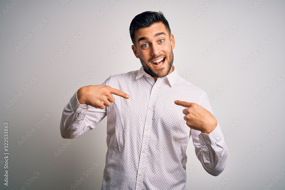 Young handsome man wearing elegant shirt standing over isolated white background looking confident with smile on face, pointing oneself with fingers proud and happy. Young handsome man wearing elegant shirt standing over isolated white background looking confident with smile on face, pointing oneself with fingers proud and happy.