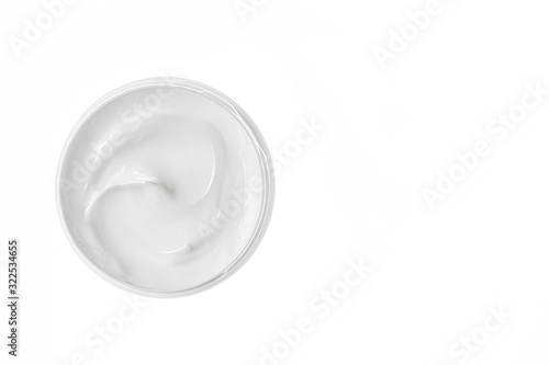 Empty white plastic compression bottle on white background. Packaging of cream, facial foam or skin care. Copy space.