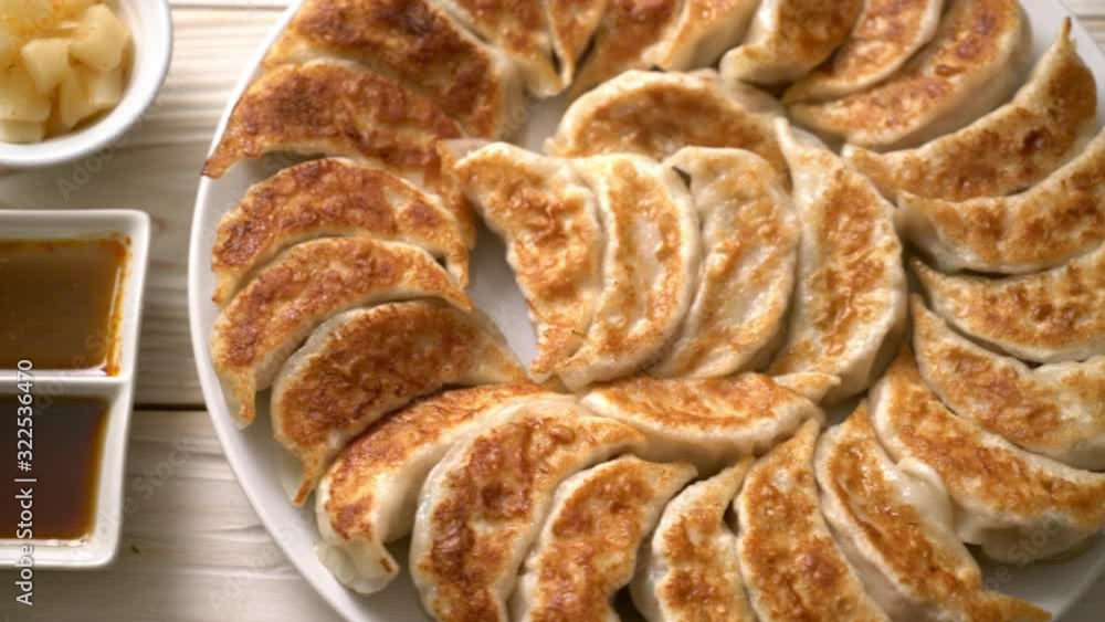 fried gyoza or dumplings snack with soy sauce in Japanese style fried gyoza or dumplings snack with soy sauce in Japanese style