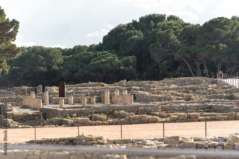 Ruins of Ampuries, La Escala behind the ruins of Empuries, in the Province of Giron, Catalonia, Spain.