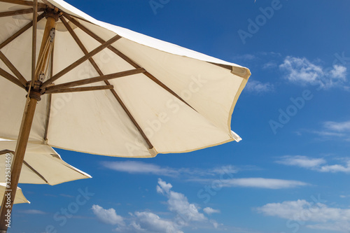 Under Umbrella On Beach On Summer Holidays Vacations