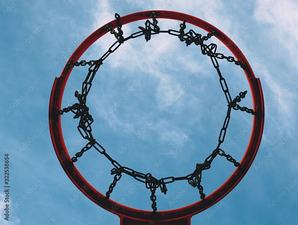 Basketball hoop and a cage with poor asphalt Basketball hoop and a cage with poor asphalt