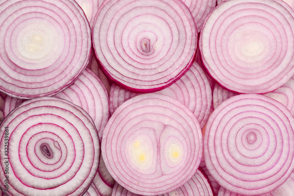 Onion slices as a background. Top view. Onion slices as a background. Top view.