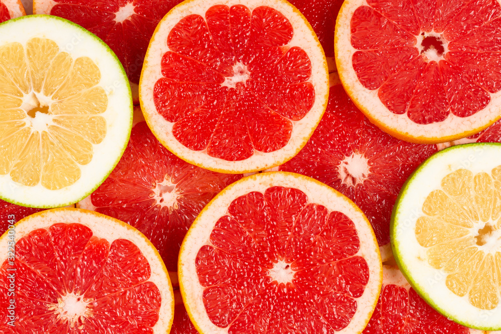 Pomelo and grapefruit slices background.