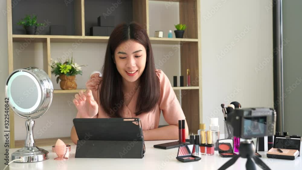 4k video of Famous blogger. Cheerful female vlogger is showing cosmetics products while recording video for everyday makeup tutorial. at work. 4k video of Famous blogger. Cheerful female vlogger is showing cosmetics products while recording video for everyday makeup tutorial. at work.
